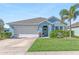 Charming light blue house with two-car garage at 25361 E Lenox Cir, Punta Gorda, FL 33950