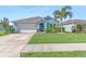 Charming light blue house with a two-car garage at 25361 E Lenox Cir, Punta Gorda, FL 33950