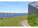 Peaceful lake view from backyard with lush landscaping at 25361 E Lenox Cir, Punta Gorda, FL 33950