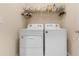 Laundry room with washer and dryer, and storage above at 25361 E Lenox Cir, Punta Gorda, FL 33950