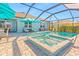 Resort-style pool and spa with covered patio and outdoor seating at 25361 E Lenox Cir, Punta Gorda, FL 33950