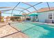 Inviting pool and spa with covered patio and lounge chairs at 25361 E Lenox Cir, Punta Gorda, FL 33950