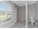 Bathroom with shower and window at 25896 Prada Dr, Punta Gorda, FL 33955