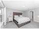 Spacious bedroom with king-size bed and ensuite bathroom at 25896 Prada Dr, Punta Gorda, FL 33955