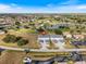 Aerial view of two-story condo units near golf course and pond at 26316 Nadir Rd # A2, Punta Gorda, FL 33983