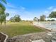 Spacious backyard with a view of the golf course and pool at 26316 Nadir Rd # A2, Punta Gorda, FL 33983