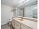 Clean bathroom with vanity and large mirror at 26316 Nadir Rd # A2, Punta Gorda, FL 33983