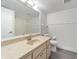 Bathroom with a vanity, toilet, and large mirror at 26316 Nadir Rd # A2, Punta Gorda, FL 33983