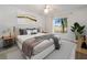 Main bedroom with large window and plush bedding at 26316 Nadir Rd # A2, Punta Gorda, FL 33983