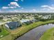 Aerial view showing house with pool and screened enclosure at 27072 Ecuador Dr, Punta Gorda, FL 33983