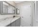 Modern bathroom with quartz countertop and gray cabinets at 27072 Ecuador Dr, Punta Gorda, FL 33983