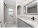 Updated bathroom with quartz countertop and gray cabinets at 27072 Ecuador Dr, Punta Gorda, FL 33983