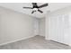 Bright bedroom with ceiling fan and large closet at 27072 Ecuador Dr, Punta Gorda, FL 33983