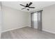 Simple bedroom with wood-look floors and ceiling fan at 27072 Ecuador Dr, Punta Gorda, FL 33983