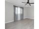 Spacious bedroom with ceiling fan and gray curtains at 27072 Ecuador Dr, Punta Gorda, FL 33983