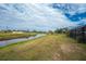 Peaceful backyard with canal view and lush landscape at 27072 Ecuador Dr, Punta Gorda, FL 33983