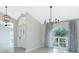 Bright dining room with hardwood floors and stylish light fixtures at 27072 Ecuador Dr, Punta Gorda, FL 33983