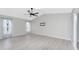 Bright Gathering room with vaulted ceiling, wood-look floors and ceiling fan at 27072 Ecuador Dr, Punta Gorda, FL 33983