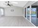 Spacious Gathering room with wood-look floors and pool view at 27072 Ecuador Dr, Punta Gorda, FL 33983