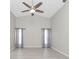 Spacious living room featuring high ceilings and a ceiling fan at 27072 Ecuador Dr, Punta Gorda, FL 33983