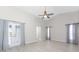 Bright living room with vaulted ceiling,grey walls and wood-look floors at 27072 Ecuador Dr, Punta Gorda, FL 33983