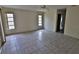 Simple bedroom with tile floors and multiple windows at 27446 Pasto Dr, Punta Gorda, FL 33983