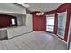 Eat-in kitchen featuring white cabinets and burgundy walls at 27446 Pasto Dr, Punta Gorda, FL 33983