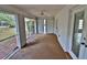 Relaxing screened porch with tile floors and ceiling fan at 27446 Pasto Dr, Punta Gorda, FL 33983