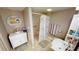 Bathroom with walk-in shower, bathtub, and white vanity at 311 Garvin St # 401A, Punta Gorda, FL 33950