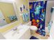 Fun bathroom with whimsical shower curtain and nautical theme at 311 Garvin St # 401A, Punta Gorda, FL 33950