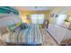 Bright bedroom with a king-size bed and beachy decor at 311 Garvin St # 401A, Punta Gorda, FL 33950