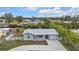 Aerial view of a single story home with a metal roof and a fenced yard at 3112 Magnolia Way, Punta Gorda, FL 33950