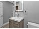 Stylish bathroom with modern vanity and a toilet at 3112 Magnolia Way, Punta Gorda, FL 33950