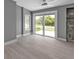 Living room with fireplace and sliding glass doors leading to the backyard at 3112 Magnolia Way, Punta Gorda, FL 33950