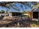 View of backyard with shed and screened porch at 3214 Amanda St, Punta Gorda, FL 33950