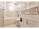 Renovated bathroom, featuring a white vanity, marble shower, and new toilet at 3214 Amanda St, Punta Gorda, FL 33950