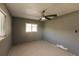 Bright bedroom with ceiling fan, neutral walls, and window coverings at 3214 Amanda St, Punta Gorda, FL 33950