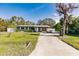 Gray house with a white fence and driveway at 3214 Amanda St, Punta Gorda, FL 33950