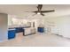 Modern kitchen with blue cabinets and granite countertops at 3214 Amanda St, Punta Gorda, FL 33950