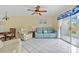 Living room with light blue couch and access to patio at 3310 Loveland Blvd # 1604, Punta Gorda, FL 33980