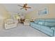 Living room with light blue couch and patio access at 3310 Loveland Blvd # 1604, Punta Gorda, FL 33980