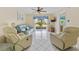 Living room with light blue couch and recliner chairs at 3310 Loveland Blvd # 1604, Punta Gorda, FL 33980