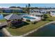 Community pool and gazebo with a view of the lake at 3310 Loveland Blvd # 1604, Punta Gorda, FL 33980