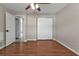 Bedroom with wood floors and door to hallway at 3450 Moravia Ave, North Port, FL 34286