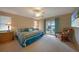 Main bedroom with king-size bed and access to the patio at 3723 Tripoli Blvd, Punta Gorda, FL 33950