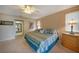 Bedroom with king-size bed and access to the bathroom at 3723 Tripoli Blvd, Punta Gorda, FL 33950