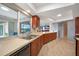 Spacious kitchen with dark wood cabinets and light countertops at 3723 Tripoli Blvd, Punta Gorda, FL 33950