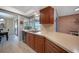 Kitchen with dark wood cabinets, a breakfast bar, and a view of the golf course at 3723 Tripoli Blvd, Punta Gorda, FL 33950