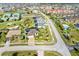 Aerial view of a single-Gathering home with pool and lush landscaping at 3937 Bal Harbor Blvd, Punta Gorda, FL 33950