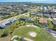 Aerial view of luxurious homes with golf course and water views at 3937 Bal Harbor Blvd, Punta Gorda, FL 33950